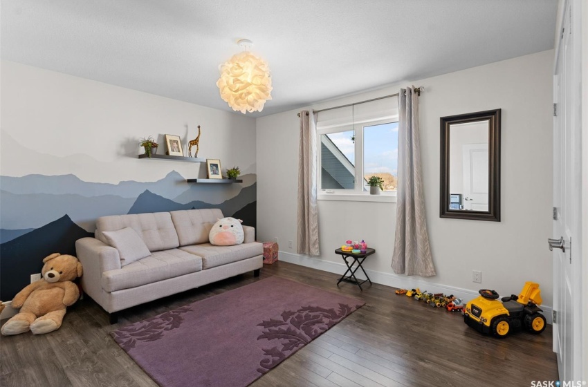 Living room with dark hardwood / wood-style floors