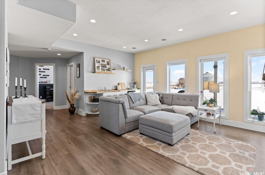 Living room featuring plenty of natural light and dark wood-type flooring