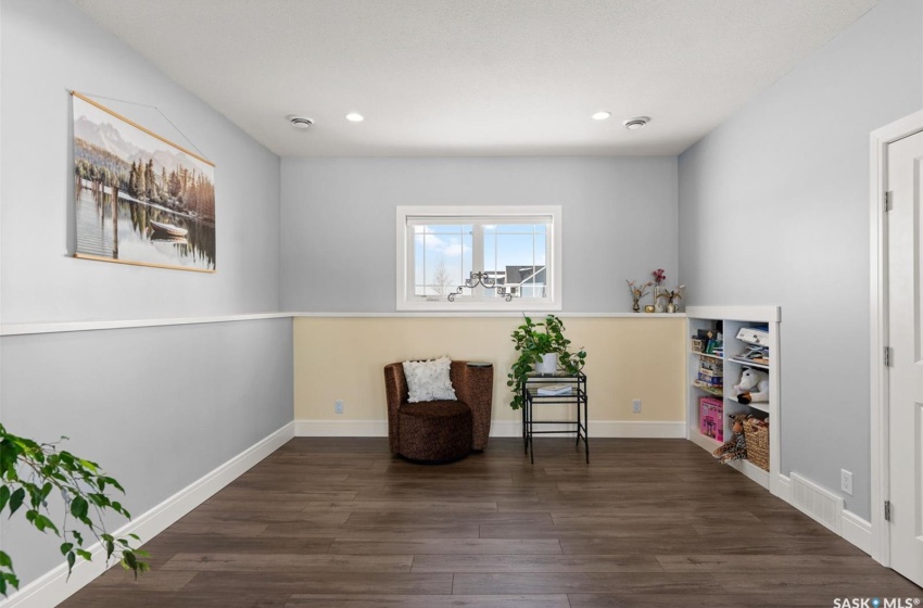 Unfurnished room featuring dark hardwood / wood-style floors