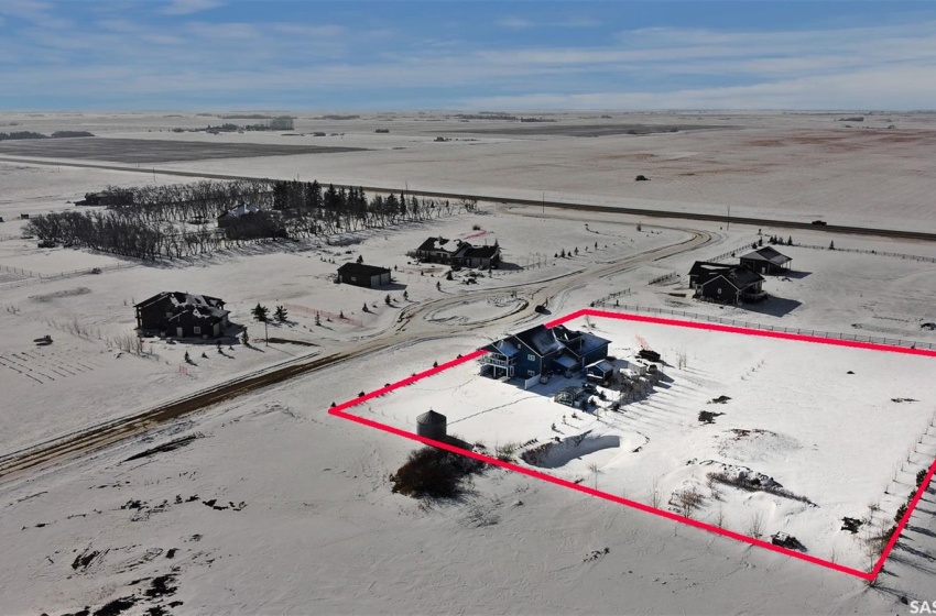 Snowy aerial view with a rural view