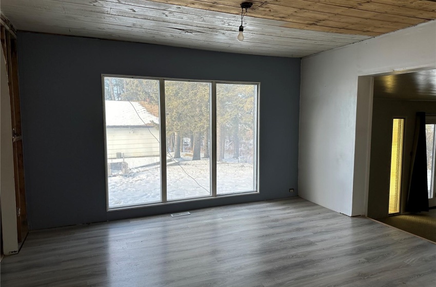 Unfurnished room with wood ceiling and dark wood-type flooring