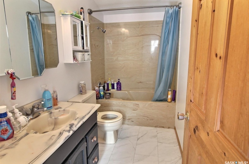 Full bathroom on second floor beside Primary Bedroom with tile flooring