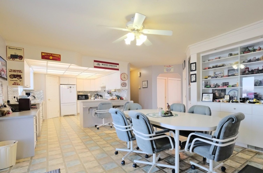 Dining area with light tile floors and ceiling fan