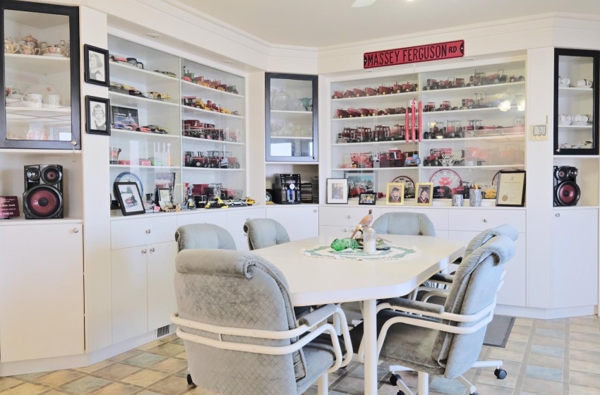 Tiled dining area featuring ceiling fan