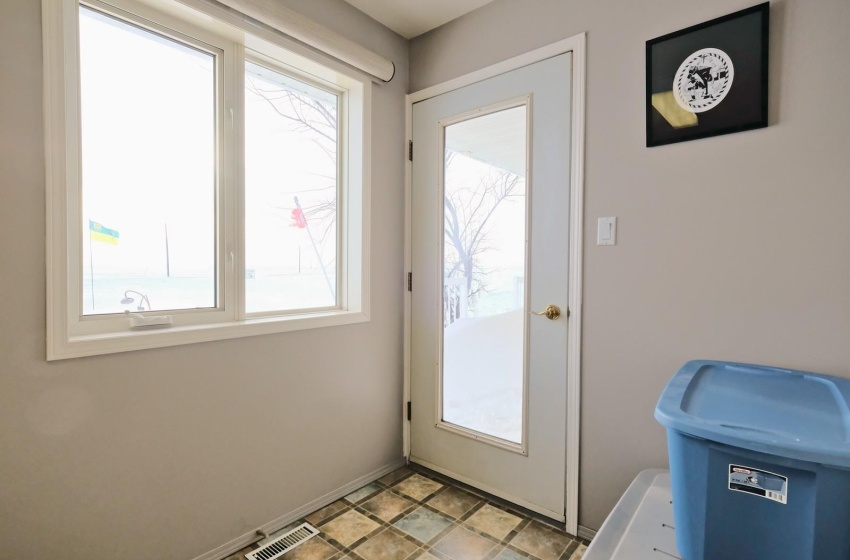 Entryway with light tile floors