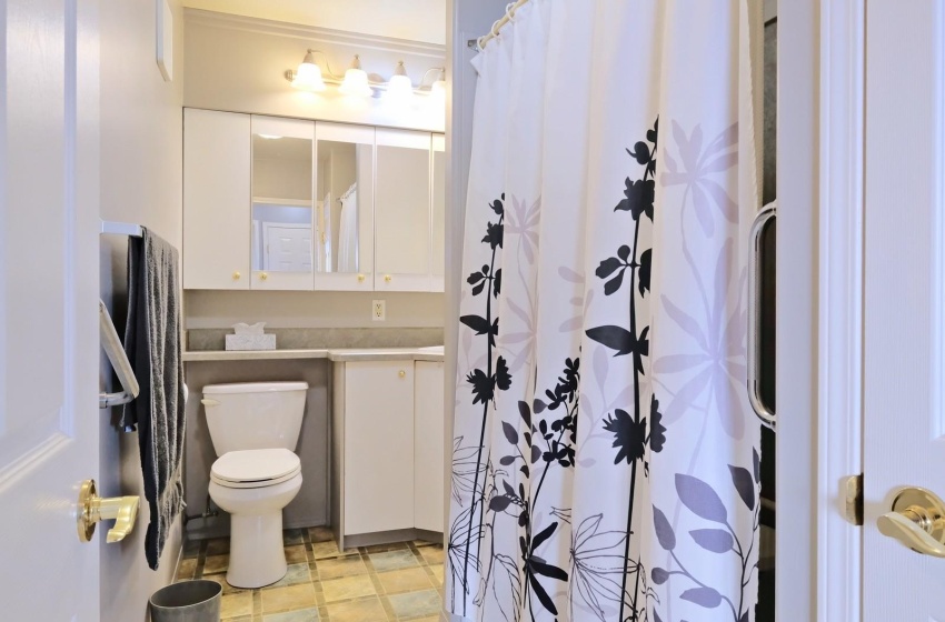 Bathroom featuring toilet, tile flooring, and large vanity