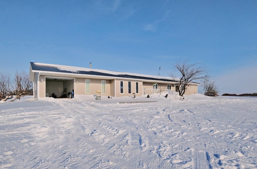 View of front facade featuring a garage