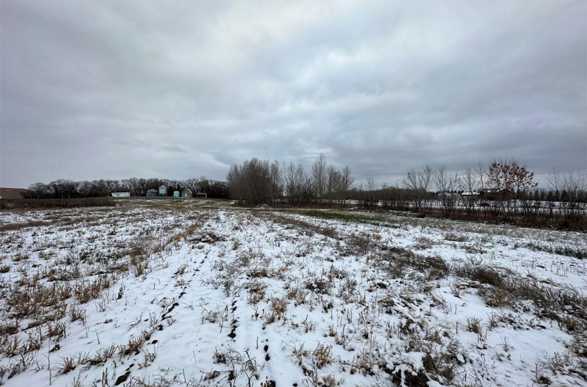 Snowy yard featuring a rural view