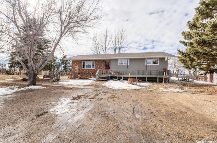 View of front of home with a wooden deck