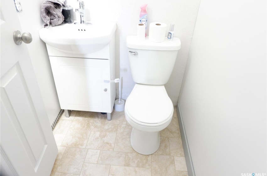 Bathroom featuring tile flooring, toilet, and vanity