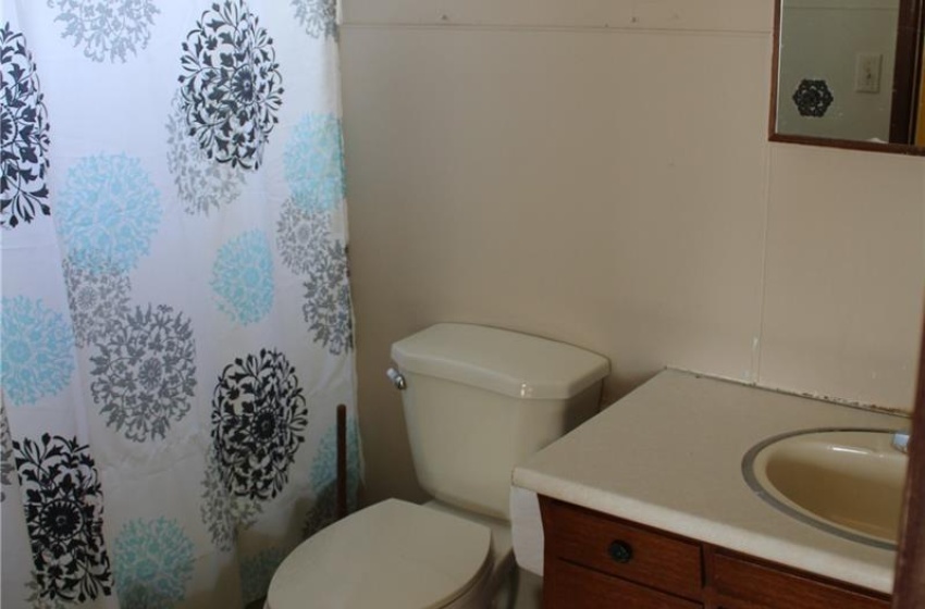 Bathroom featuring tile flooring, vanity, and toilet