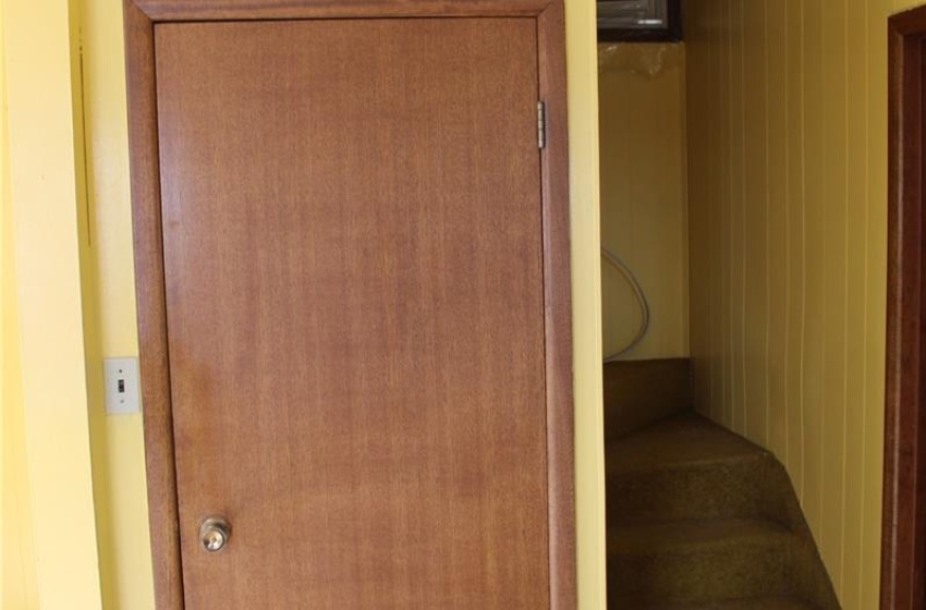 Stairway featuring an AC wall unit