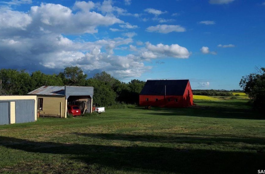 View of yard with a storage unit