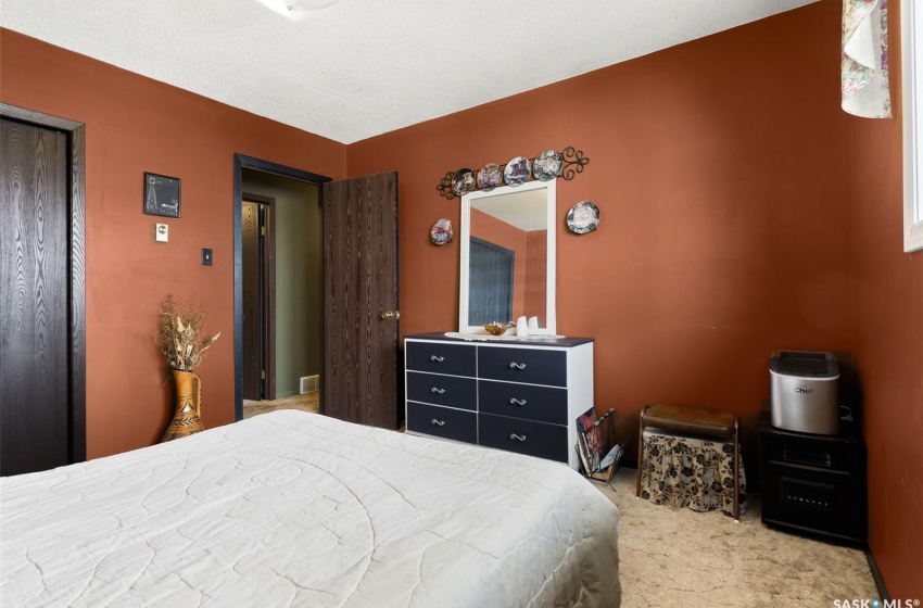 Bedroom with light colored carpet