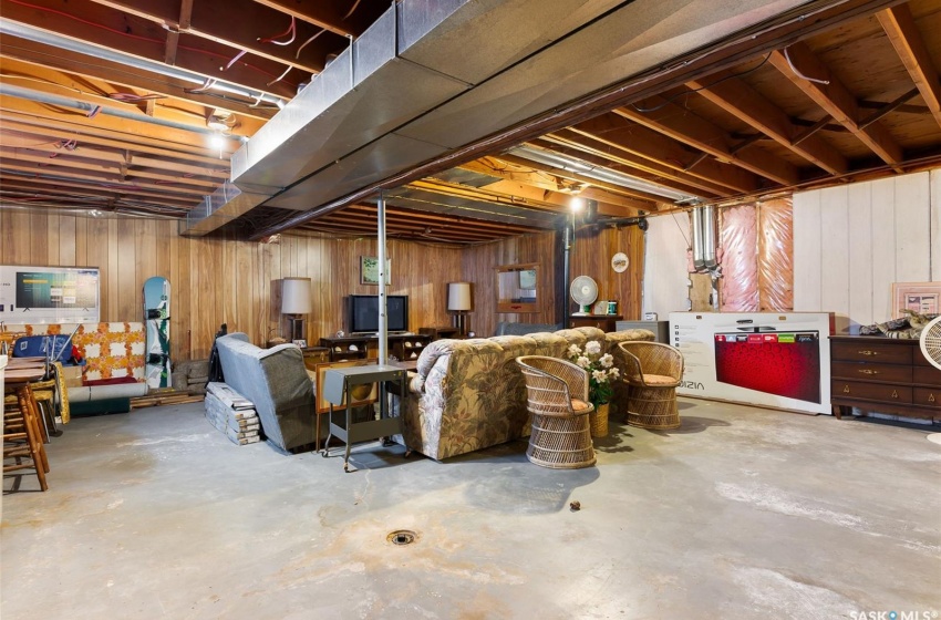 Basement featuring wood walls