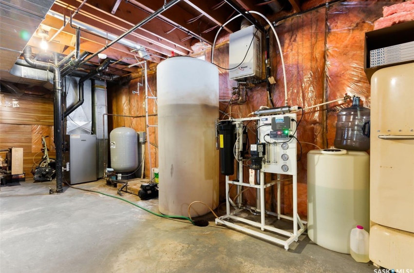 Utility room featuring water heater