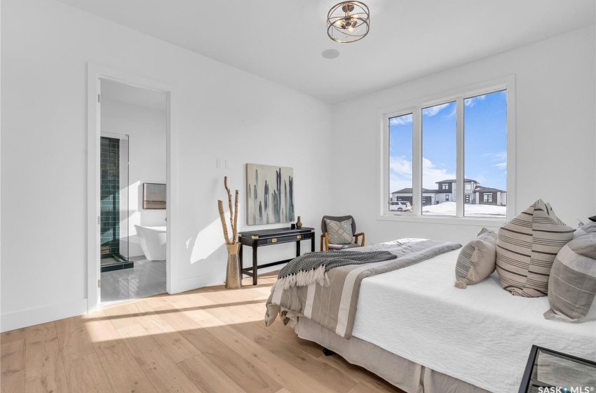 Primary Bedroom featuring light flooring and an abundance of natural light.