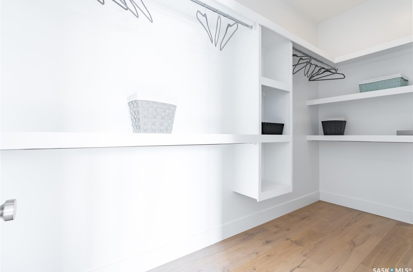 Spacious closet featuring light flooring