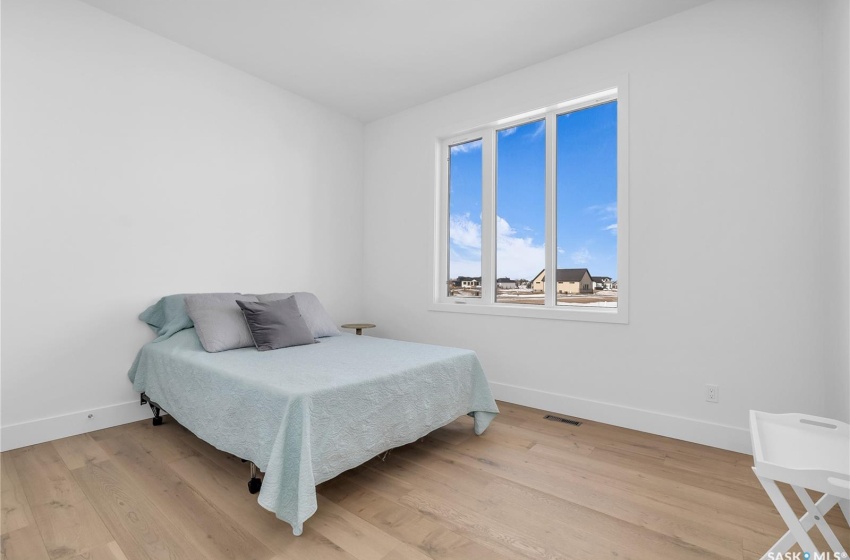 Bedroom featuring light flooring