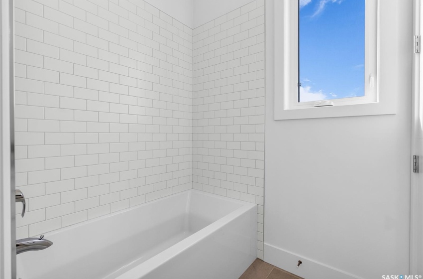 Bathroom with tile floors and vanity with extensive cabinet space