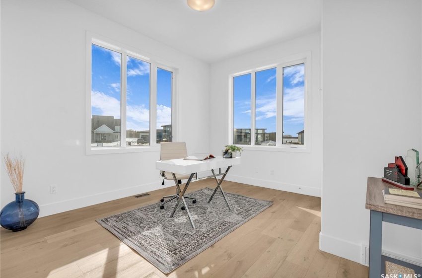 Office featuring a wealth of natural light and light floors