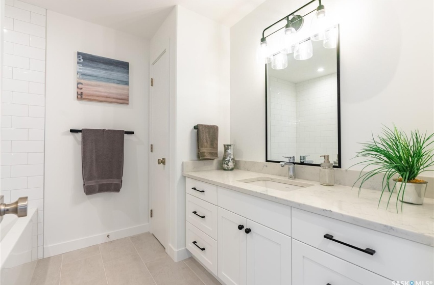 Bathroom featuring tile floors and oversized vanity