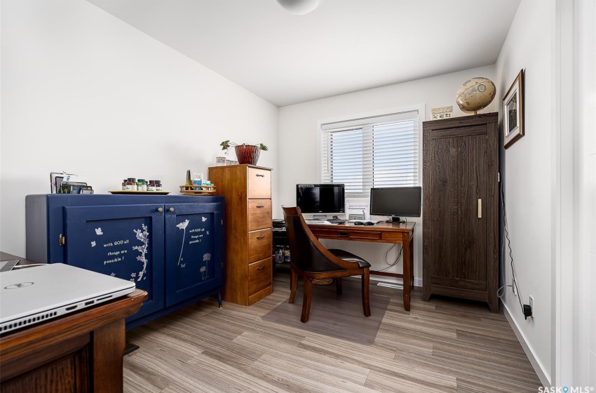 Home office featuring light hardwood / wood-style flooring