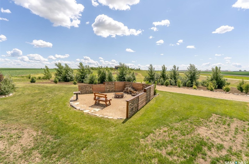 View of yard featuring an outdoor fire pit and a rural view