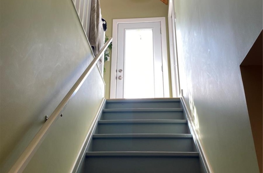 Staircase with wooden ceiling