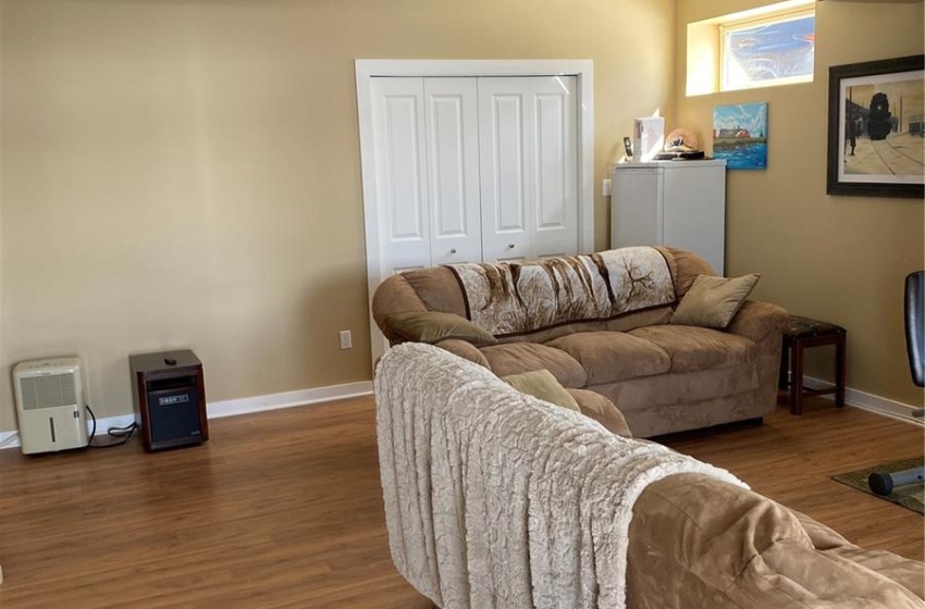 Living room with dark hardwood / wood-style flooring