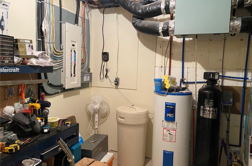 Utility room featuring electric water heater