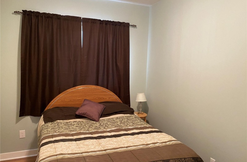 Bedroom featuring dark hardwood / wood-style floors