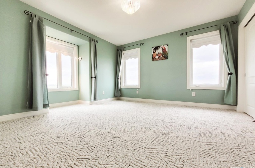 Bedroom with light colored carpet