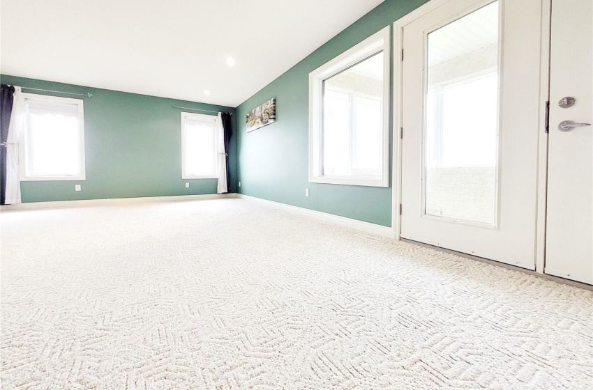 Master bedroom with a balcony