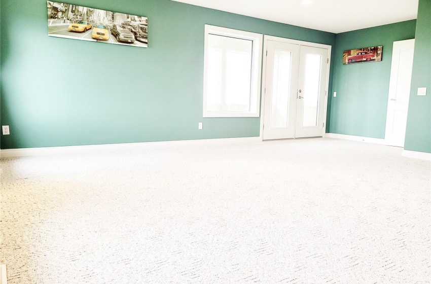 Master bedroom with light colored carpet