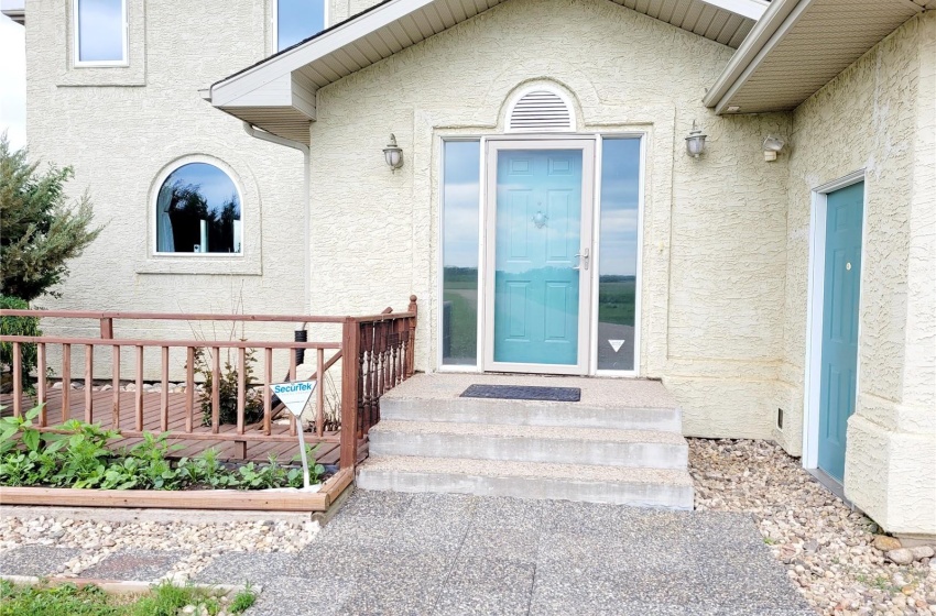 Doorway to property with a wooden deck