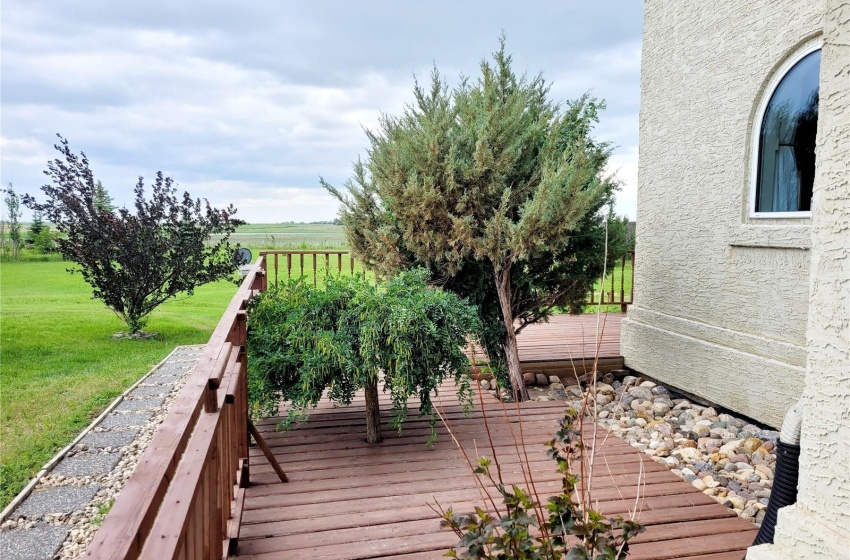 Wooden terrace featuring a yard