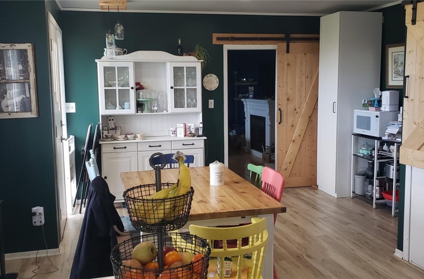 Dining room featuring a barn door and light hardwood / wood-style flooring