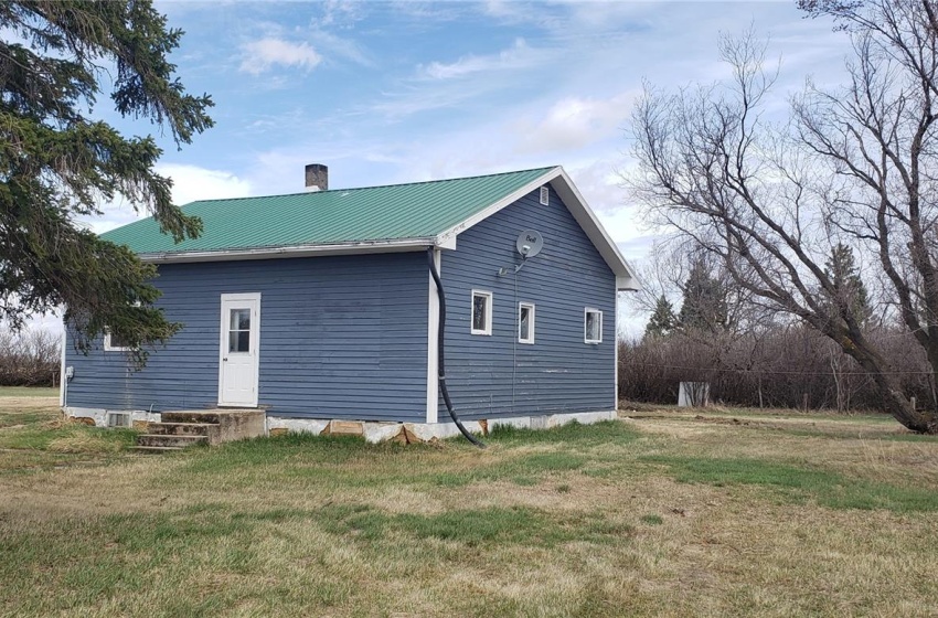 View of home's exterior with a yard