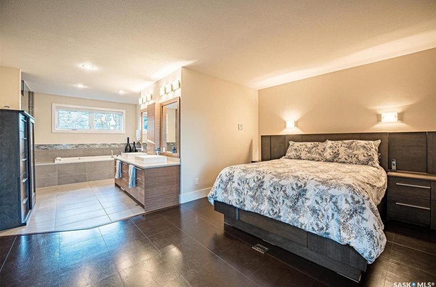 Tiled bedroom with sink