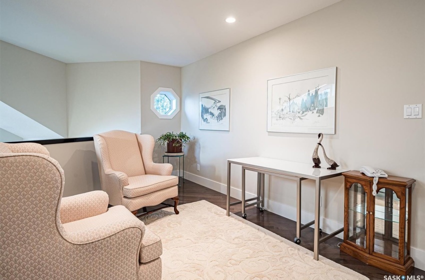 2nd storey sitting area with hardwood flooring