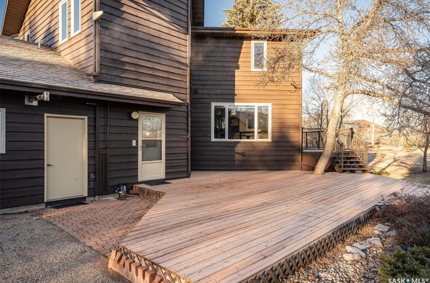 Wooden Patio with rear entrance to home/garage