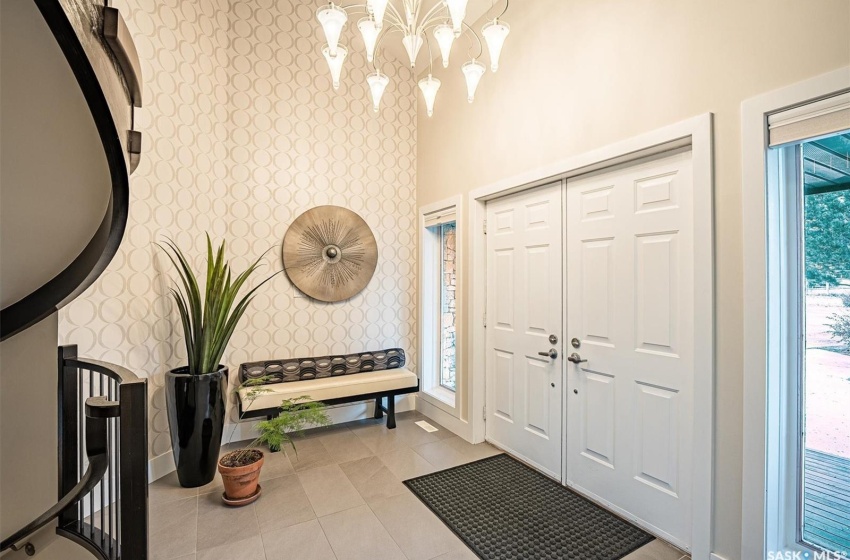 Grand Entry featuring a tiled floor & chandelier