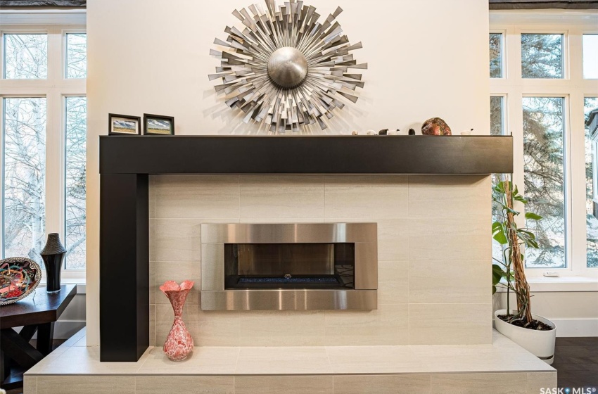 Room details featuring a tile natural gas fireplace