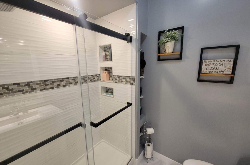 Bathroom with toilet and an enclosed shower