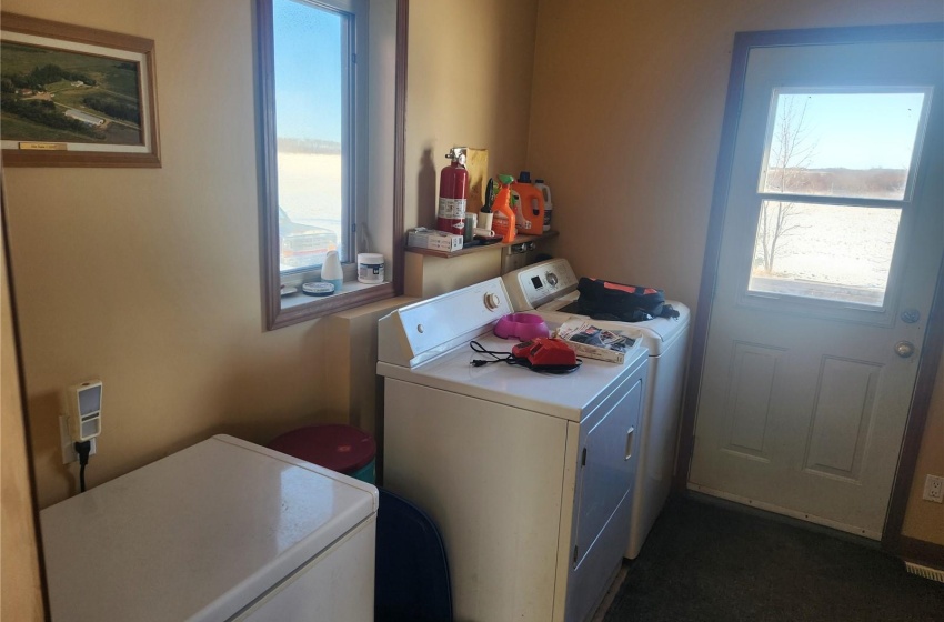 Washroom with plenty of natural light and independent washer and dryer