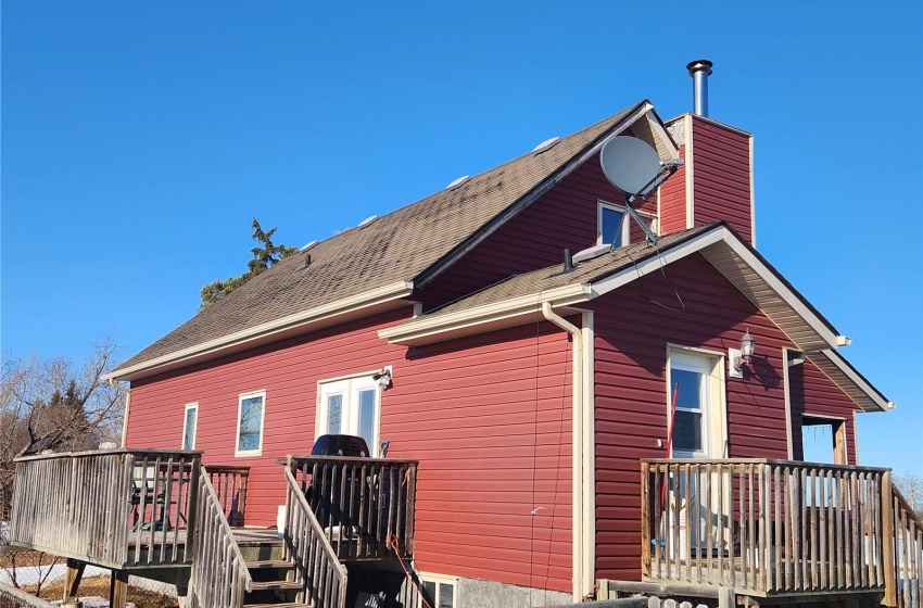 View of home's exterior with a wooden deck