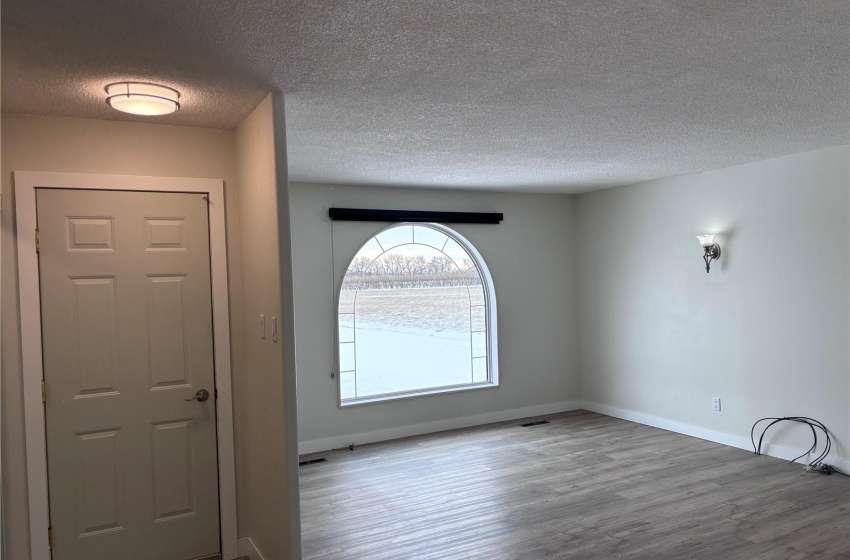 Front entrance foyer and living room, east facing window