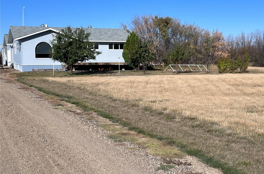 Front of house with apple trees surrounding