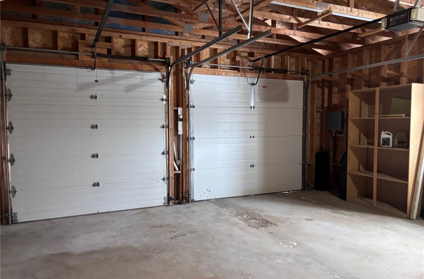 Garage featuring a garage door opener, 2x6 walls 10' high